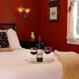 Red wine on bed in Creole Queen