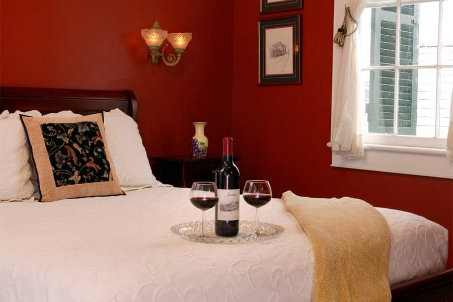 Red wine on bed in Creole Queen